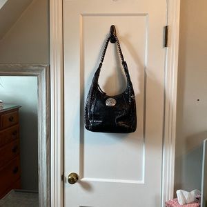 Brighten black alligator skin hobo bag.